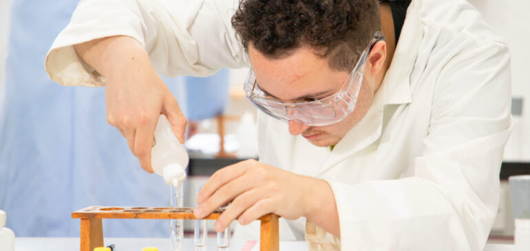 A Level Chemistry student working in Science lab
