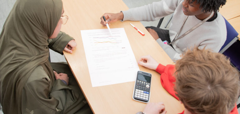 A Level Maths students working on maths problems in classroom