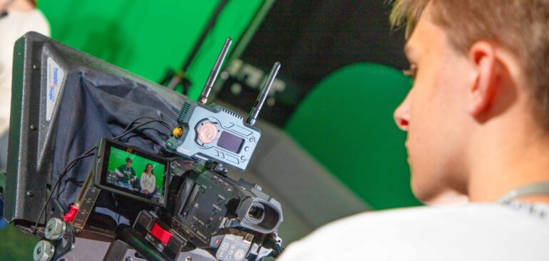 Level 3 Creative Media Production student in Eskdale TV Studio operating a studio camera