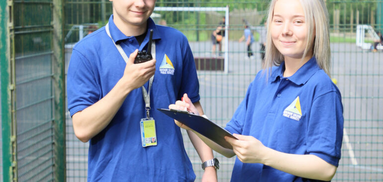 Level 3 Public Services two students on radio outside Dalehead courts