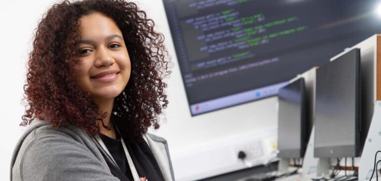A Level Computer Science student working at digital computer in Patterdale