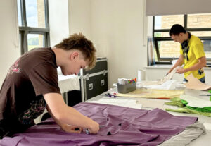 CR-7693 A Level Textiles Summer Project with students sewing